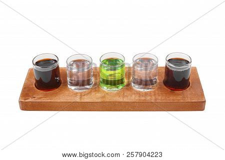 Multicolored Transparent Cocktails, A Set Of Shots In One Row, Five Servings On A Wooden Stand, Subs