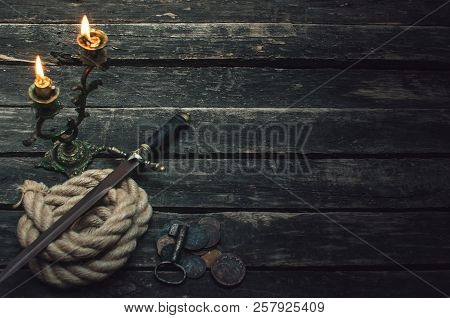 Pirate Captain Table With Mooring Rope, Dagger Knfe Weapon, Coins, Key Of Treasure Chest And Burning