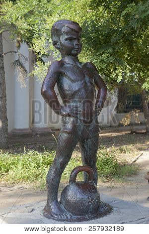 Evpatoria, Crimea, Russia - June 30, 2018: Sculpture Boy With Weights On The Gorky Embankment In Evp
