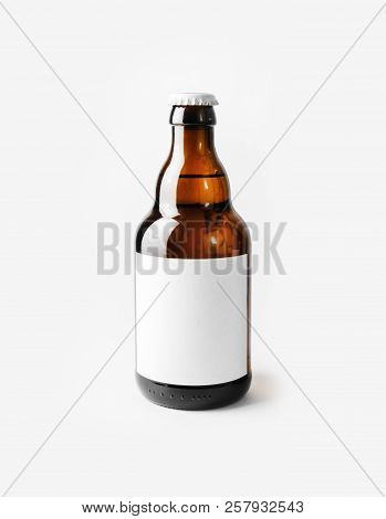 Brown Beer Bottle With Blank Label. Responsive Design Mockup.