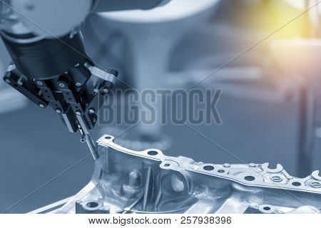 The Robotic Arm Catch The Steel Plug For Manufacturing   Process .the Hi-technology For Automotive  