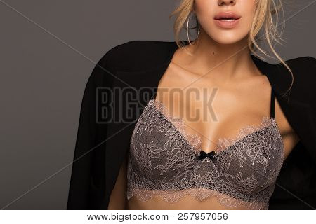 Blonde In Lingerie And White Jacket. Show The Bra