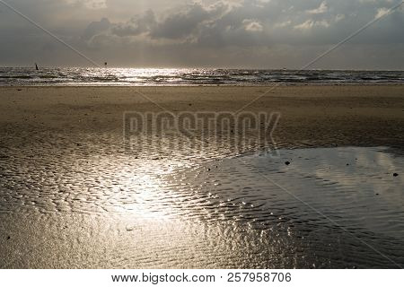 Sunset On The Beach Of Norderney At Low Tide. Wide Angle View