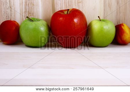 Beautifully Laid Out Fresh Summer Fruits On A Background Of Cutting Boards