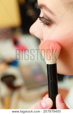 Visage Concept. Close Up Woman Getting Make Up On Cheeks. Applying Blush With Brush.