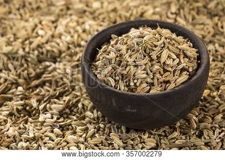 Fennel Seeds In A Small Wooden Bowl - Foeniculum Vulgare