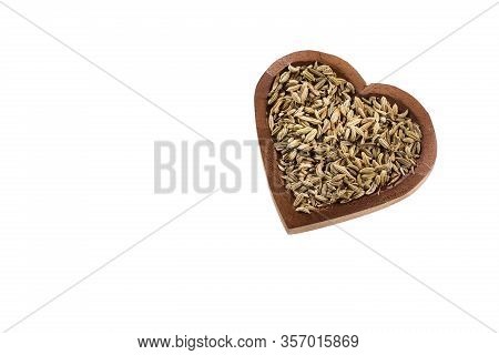 Fennel Seeds In A Heart-shaped Wooden Bowl - Foeniculum Vulgare