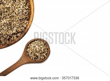 Dried Fennel Seeds In A Wooden Bowl With Wooden Spoon - Foeniculum Vulgare