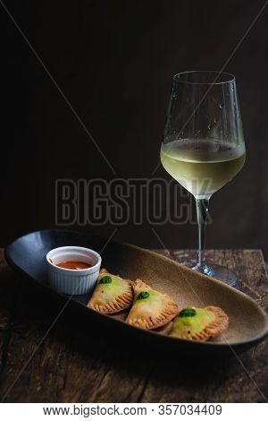 Chicken Empanadas La Abuela Style Pastry Puffs, Spinach, Green Chimichurri Sauce