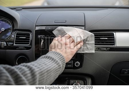 Man Cleaning Front Dashboard Of A Car Using Antivirus Antibacterial Wet Wipe (napkin) For Protect Hi