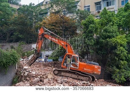 Chongqing, China - May 9, 2010: Downtown, Off Peoples Square. Red Daewoo Demolition Crane On Top Of 