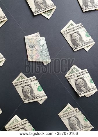 American One Dollar Bills And Czech Banknote Of 100 Korun On The Black Background