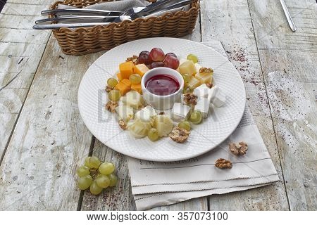 Cheese Plate: Parmesan, Cheddar, Gouda, Mozzarella And Other With Basil. Tasty Appetizers.