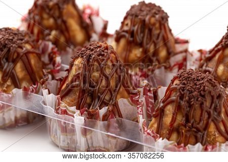 Cake Anthill On A White Background. Anthill Cake In A Plastic Container From A Supermarket.