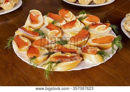 Sandwiches With Red Fish For Lunch In A Cafe. Buffet In A Mediterranean Restaurant. Tapas With Salmo
