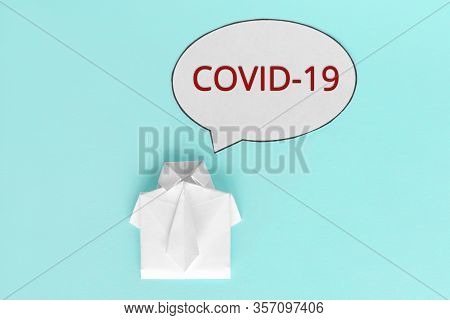 Talk About Coronavirus. Dialog Cloud With The Inscription Covid-19. Quarantine. White Figure Of A Ma
