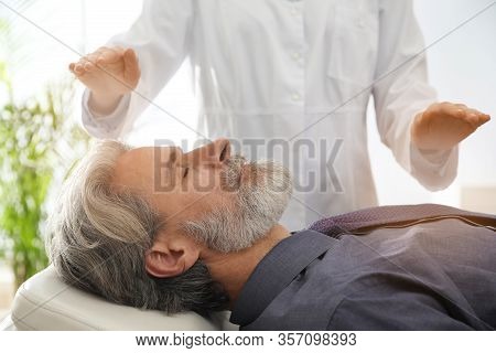 Psychotherapist And Patient In Office. Hypnotherapy Session