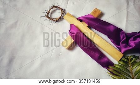 Lent Season,holy Week And Good Friday Concepts - Image Of Wooden Cross With Purple Cloth On It