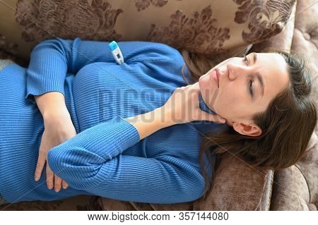 The Girl Feels Suffocation In Her Throat. Close-up. The First Signs Of Coronavirus. The Concept Of A