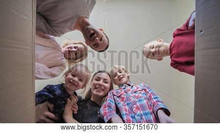 A Large Family Opens The Parcel And Find The Manjarins.