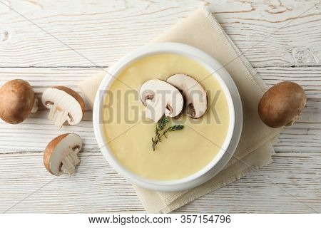 Mushroom Cream Soup On Wooden Background, Top View
