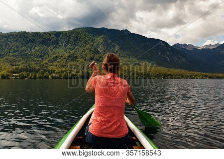 Girl Kayaking In The Scenic Bohinj Lake, Slovenia