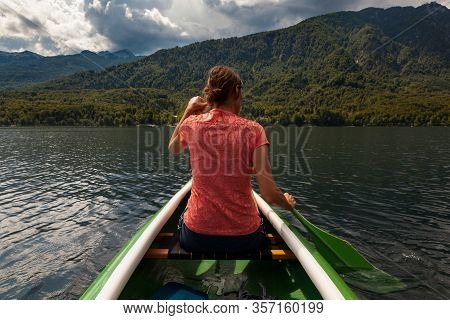 Girl Kayaking In The Scenic Bohinj Lake, Slovenia