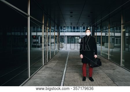 Caucasian Young Man Near His Office Wearing Surgical Face Mask To Protect From Coronavirus Covid-19