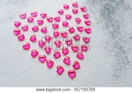 Heart Made Of Pink Plastic Hearts On A White Background