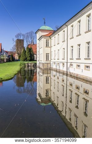Castle Westerholt With Reflection In The Water In Germany