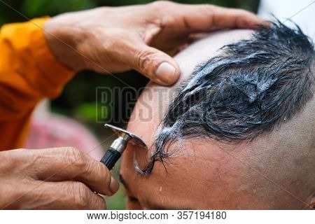 Close Up Shot Of Shaved Hair For Ordained Buddhist Man. Ordain Into Monkhood, Thailand