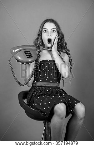 Surprised Kid Sit On Chair Dial Phone. Communication Concept. Retro Style. Shopping Online. Retro Gi