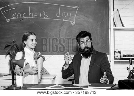 Spring. Back To School. Happy Teachers Day. Small School Girl Kid With Flower Bouquet. Knowledge Day