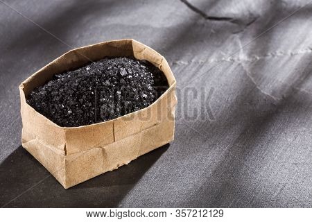 Hawaiian Black Salt In Paper Bag. Text Space
