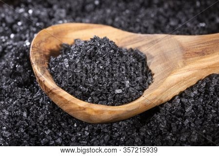 Hawaii Black Salt On Wooden Spoon. Text Space