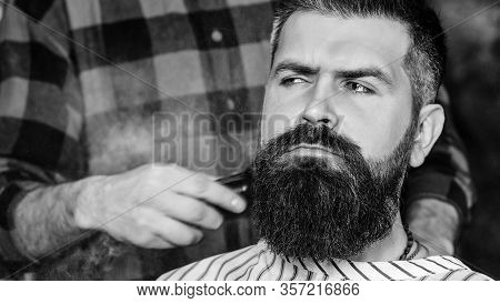 Confident Man Visiting Hairstylist. Barber Shop. Bearded Hipster Getting New Hairstyle. Vintage Barb