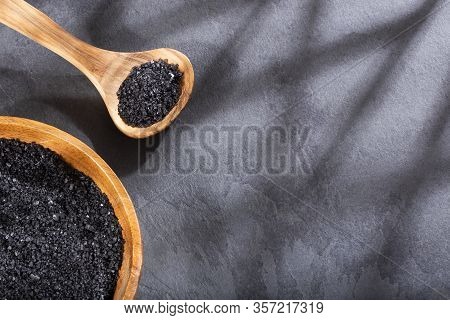 Hawaii Black Salt On Wooden Spoon. Text Space