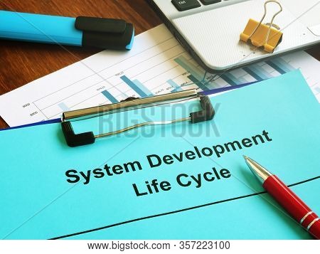 System Development Life Cycle Sdlc Papers And Clipboard.