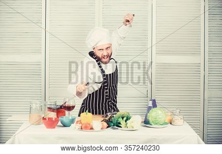 Chef Hold Cleaver Knife Tool Ready To Chop Ingredients. Man Wear Apron Cooking In Kitchen. Man Use S