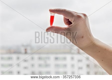 Laboratory Tubes In The Doctor S Hand With Blood Serum Infected Patient. Blood Test For Coronavirus.