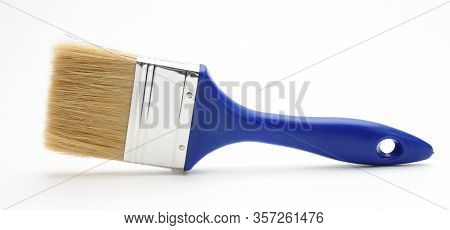 Blue Paint Brush On An Isolated White Background