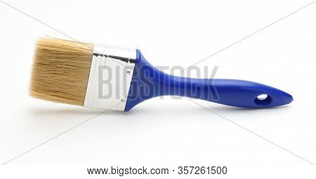 Blue Paint Brush On An Isolated White Background