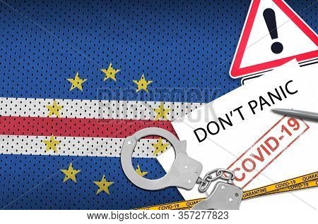 Cabo Verde Flag And Police Handcuffs With Inscription Dont Panic On White Paper. Coronavirus Or 2019