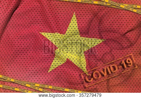 Vietnam Flag And Covid-19 Biohazard Symbol With Quarantine Orange Tape And Stamp. Coronavirus Or 201