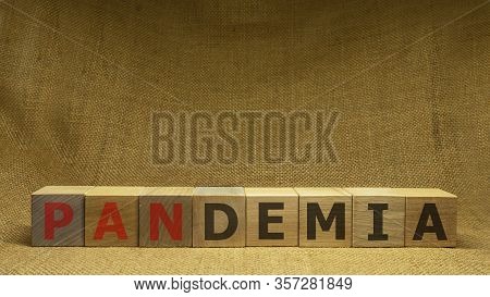 Wooden Cubes With Red And Black Word Pandemia On Sackloth Background. Pandemia And Covid-19 Concept.