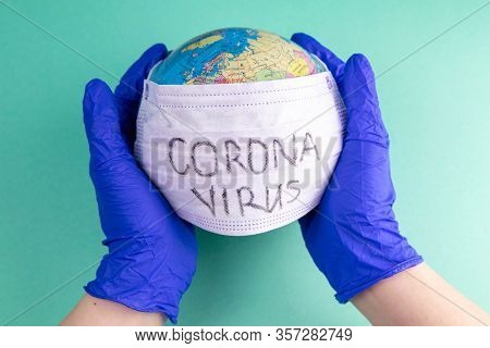 World Corona Virus Attack Concept. World Earth Put Mask To Fight Against Corona Virus. Concept Of Fi