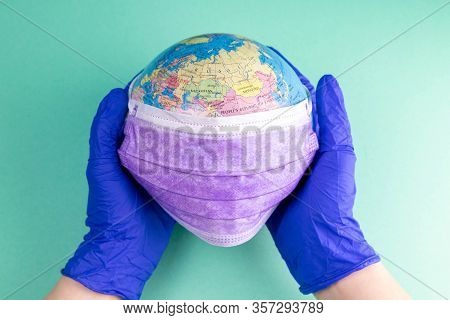 World Corona Virus Attack Concept. World Earth Put Mask To Fight Against Corona Virus. Concept Of Fi