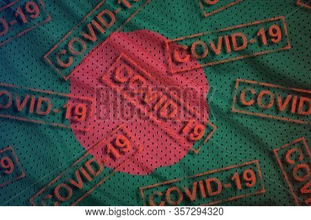Bangladesh Flag And Many Red Covid-19 Stamps. Coronavirus Or 2019-ncov Virus Concept