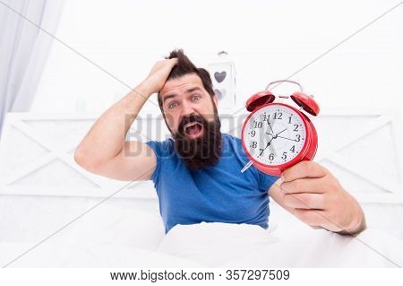 Stress Concept. Man Awake Unhappy With Alarm Clock Ringing. Insomnia Drives Me Crazy. Wakes Up In Mo
