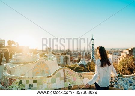 Young Smiling Female Tourist Spending Vacation In Barcelona,catalonia,spain.traveling To Europe..pan